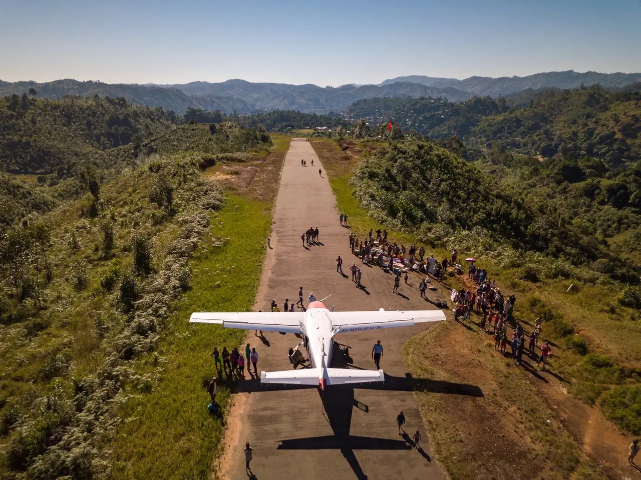 Drone shot of a MAF airplane on a remote mountain airstrip